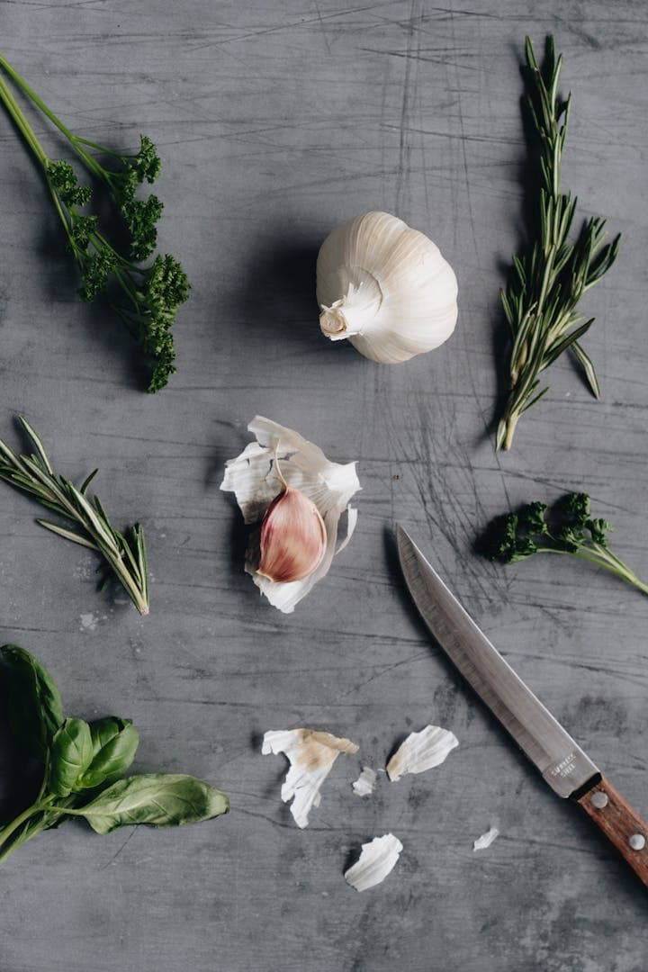 Knife near garlic cloves