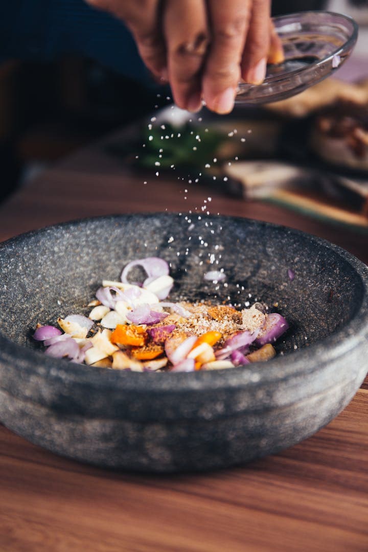 Chef salting a dish